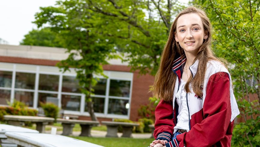 image of student sitting outside