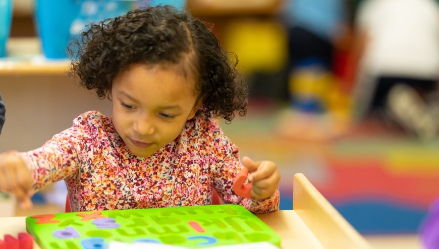 child playing with a puzzle