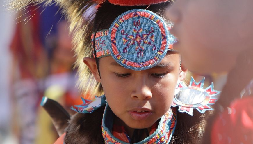 Native American boy, native headband, blue and orange