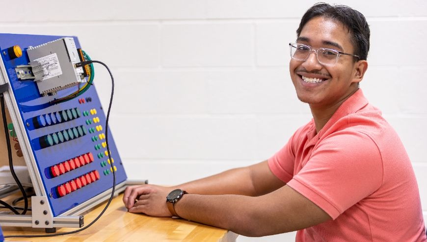 Student sitting in a technology lab