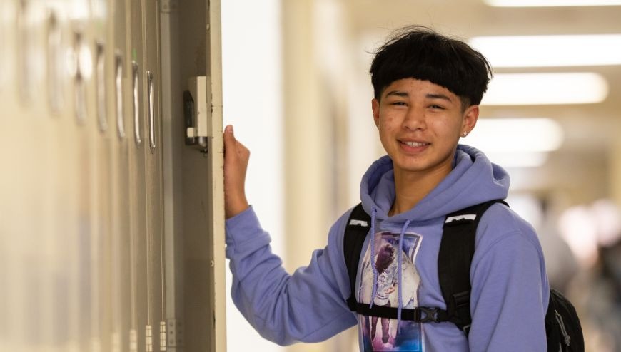 image of student opening locker