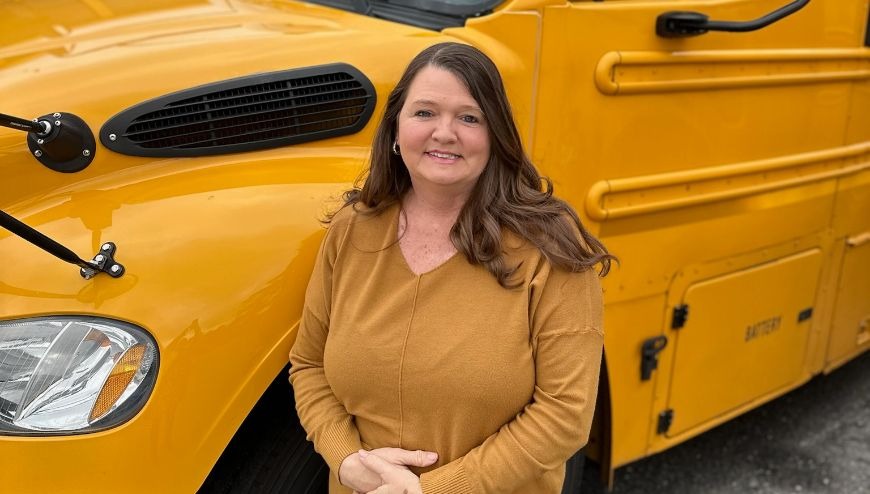 bus driver in front of bus