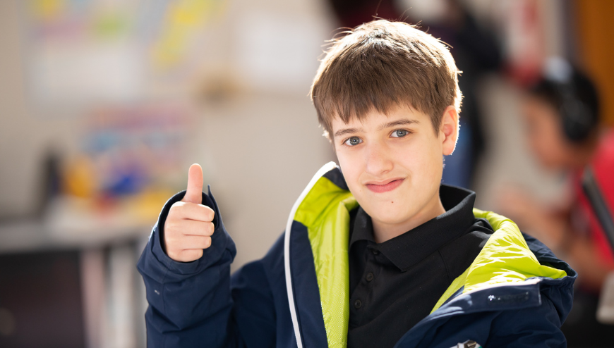 Boy giving a thumbs up