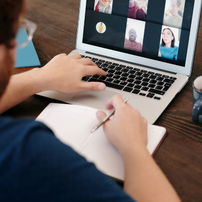 Child typing on laptop