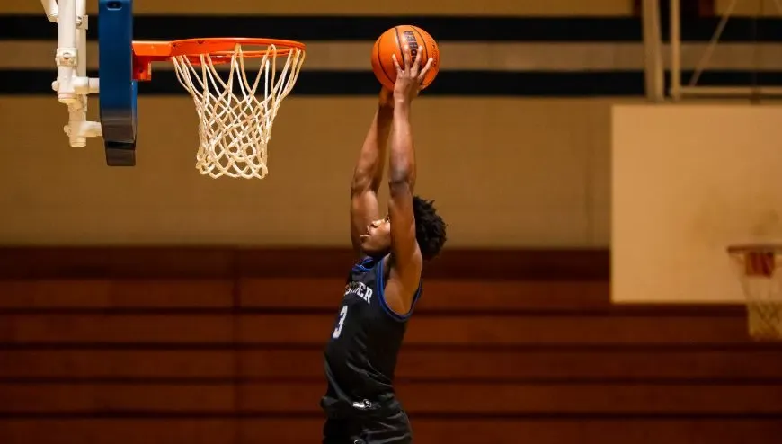 Image of basketball player dunking a ball