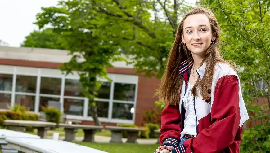 image of student sitting outside