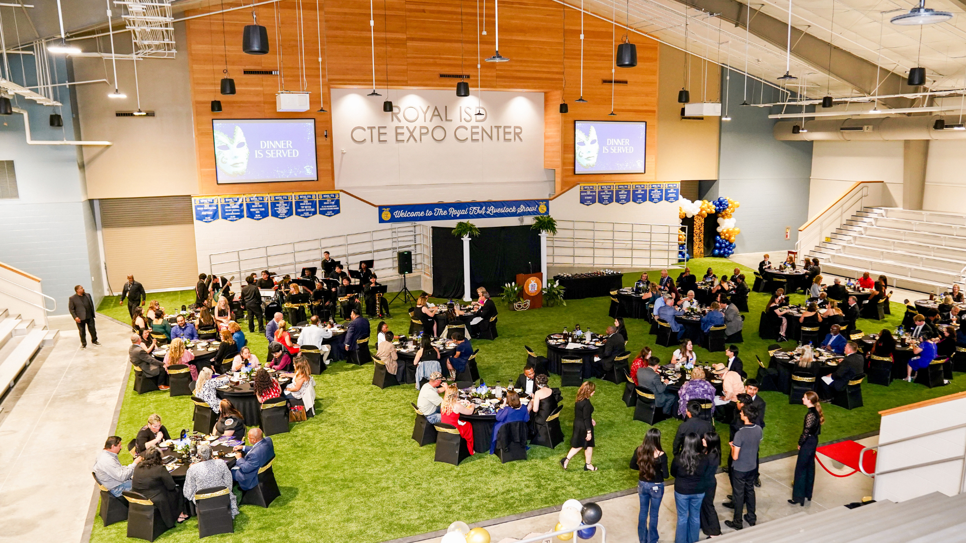Wide view of guests seated for dinner during the Royal ISD Teacher of the Year Gala inside the Royal ISD CTE Expo Center.
