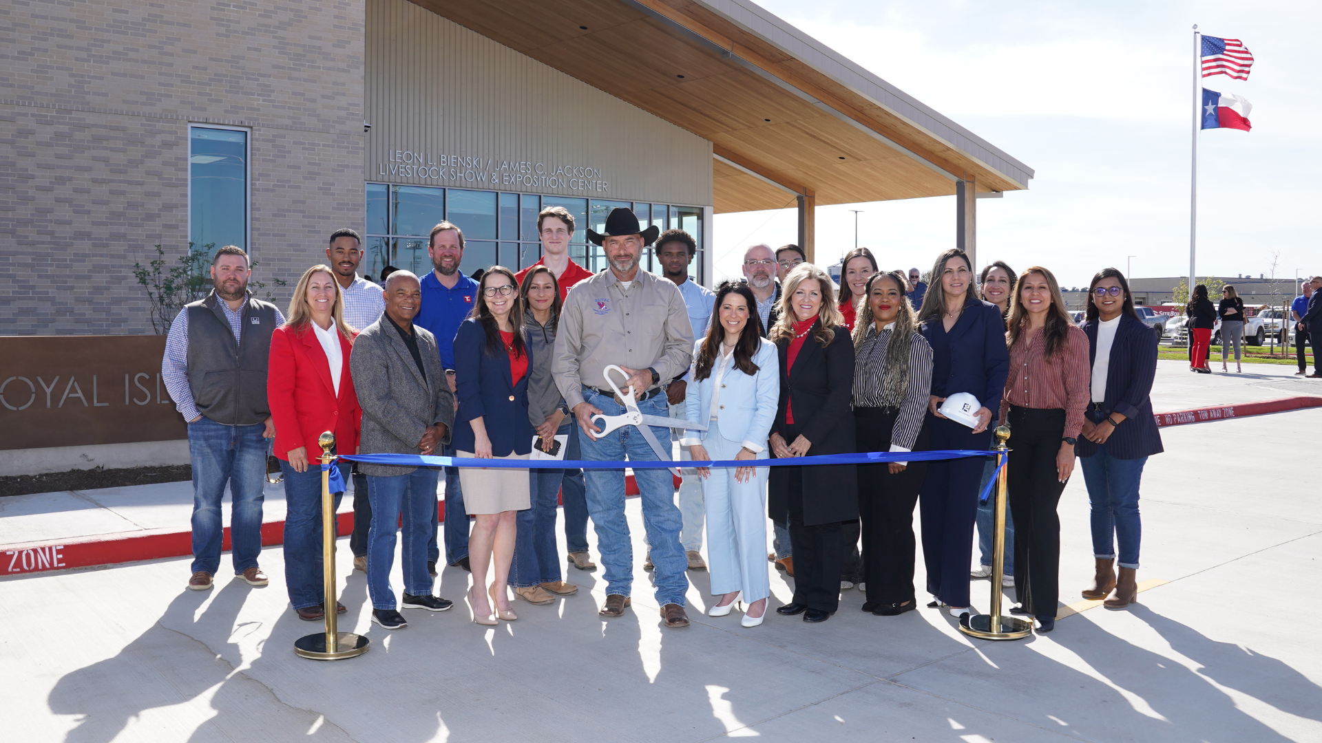 Royal ISD leaders, staff, students, and community members gather outside the CTE/Ag Expo Center for the opening and ribbon cutting ceremony.