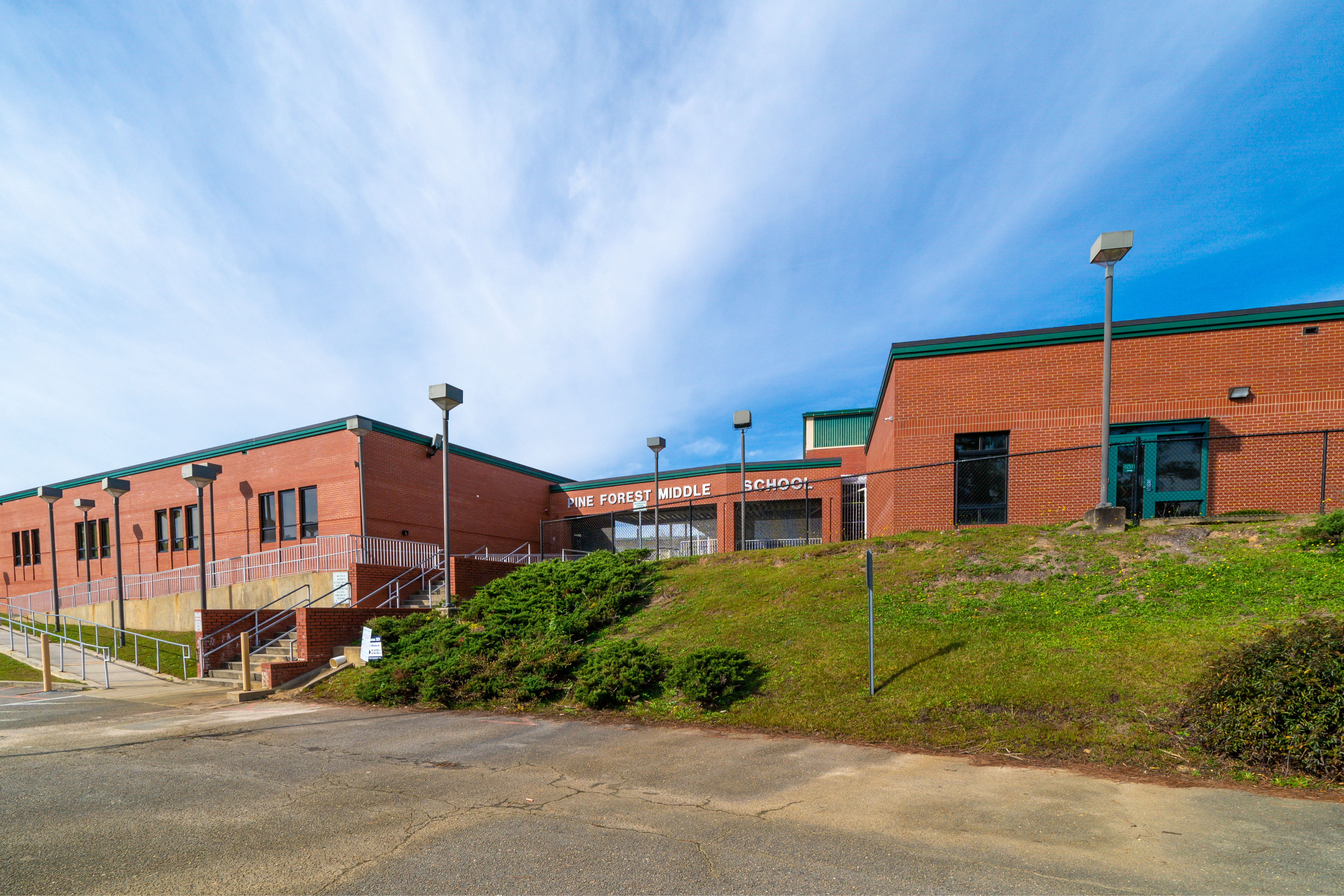 A photo of the front of pine forest middle