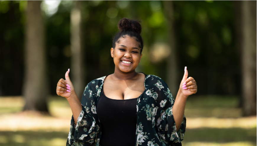 image of a girl with her thumbs up