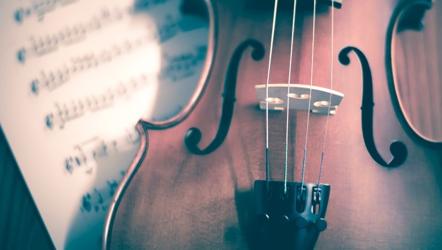 Image of a violin with sheet music