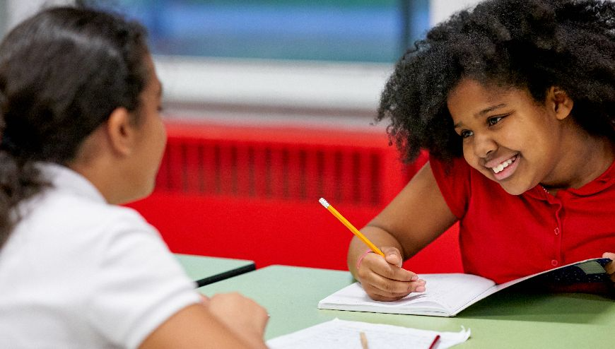 Image of two students doing homework together