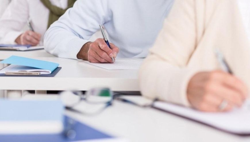 Image of students' hands writing