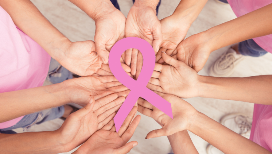 Image of hands palms up witht the breast cancer logo