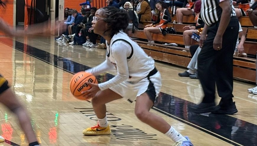 Image of a girl's varsity basketball game.