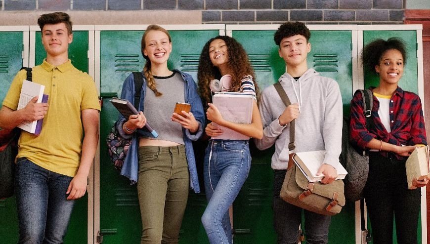 Image of high school students by lockers
