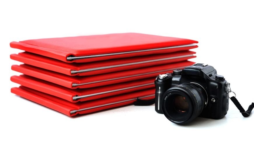 Image of stacked pictures and a camera