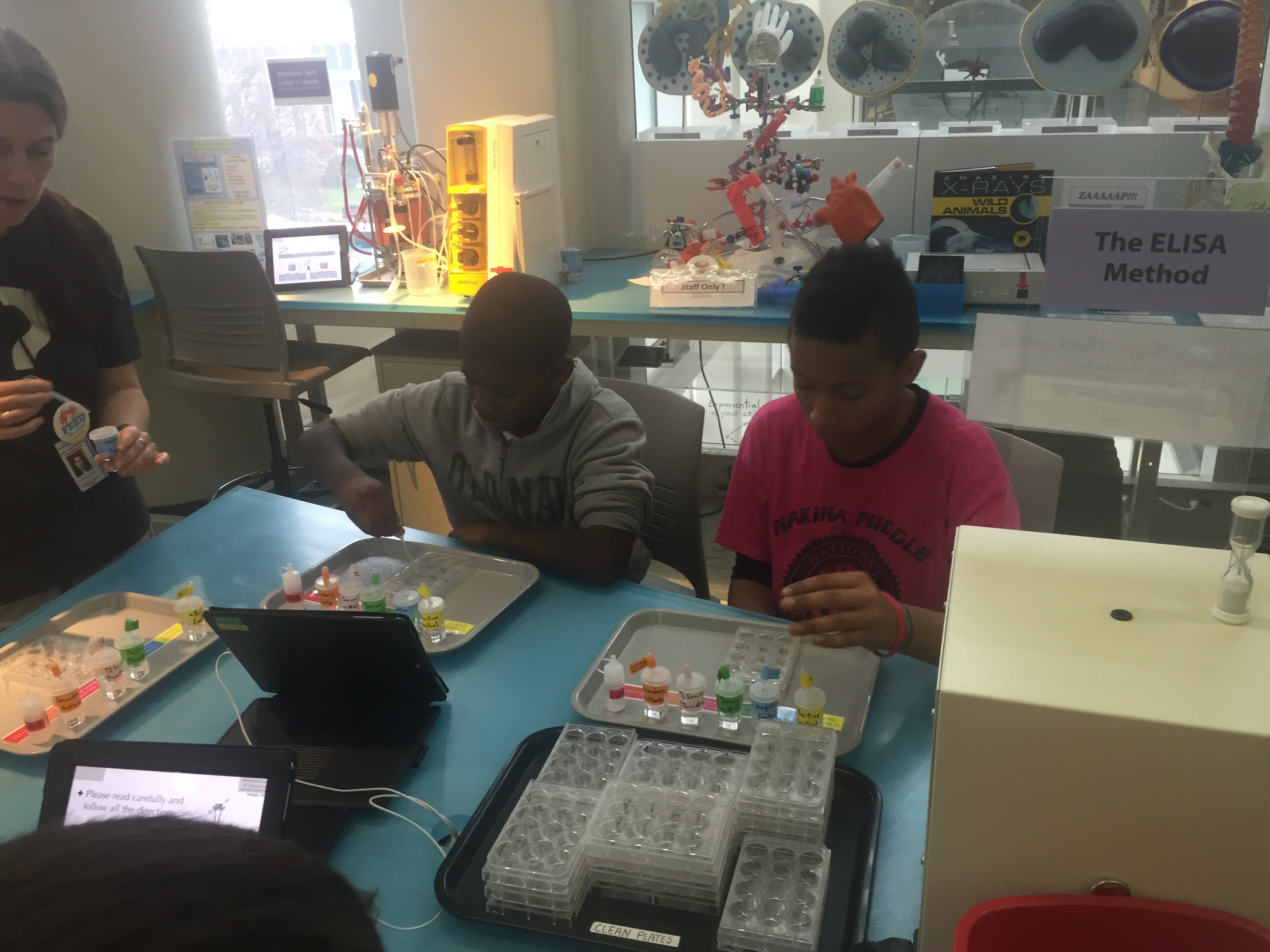 Children collaborating on a science project in a laboratory setting.