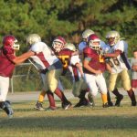  Team of football players on field.