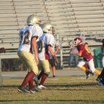  Team of football players on field.