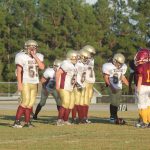  Team of football players on field.