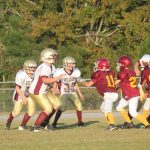  Team of football players on field.