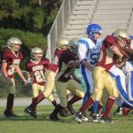  Team of football players on field.