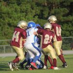  Team of football players on field.