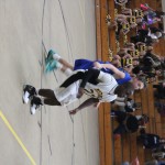 Basketball players in action on the court during a game.