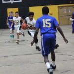 Boys' basketball team playing energetically on the court.