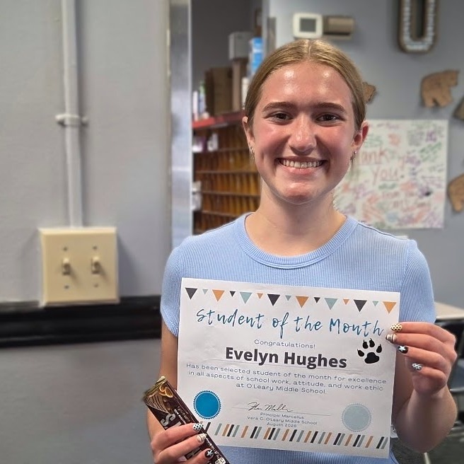 A young woman holds a certificate with a chocolate bar, both displayed on a light blue background.
