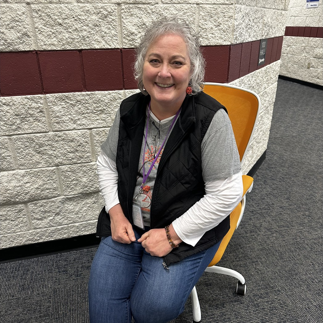 Mrs. Hinton, Title/ML Teacher Smiling for Golden Chair Picture