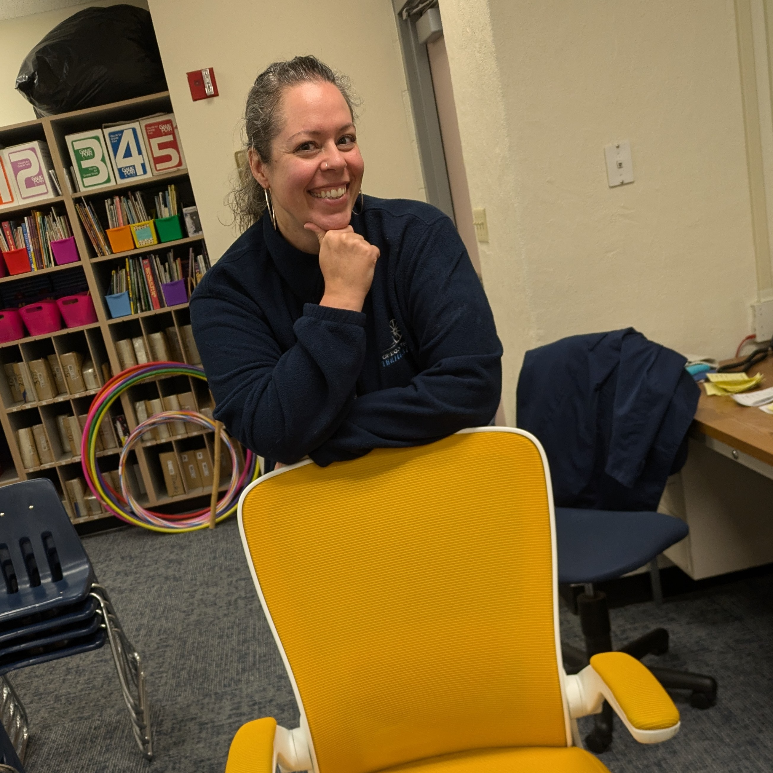 Ms. Phillips, Music Teacher Smiling for Golden Chair Picture