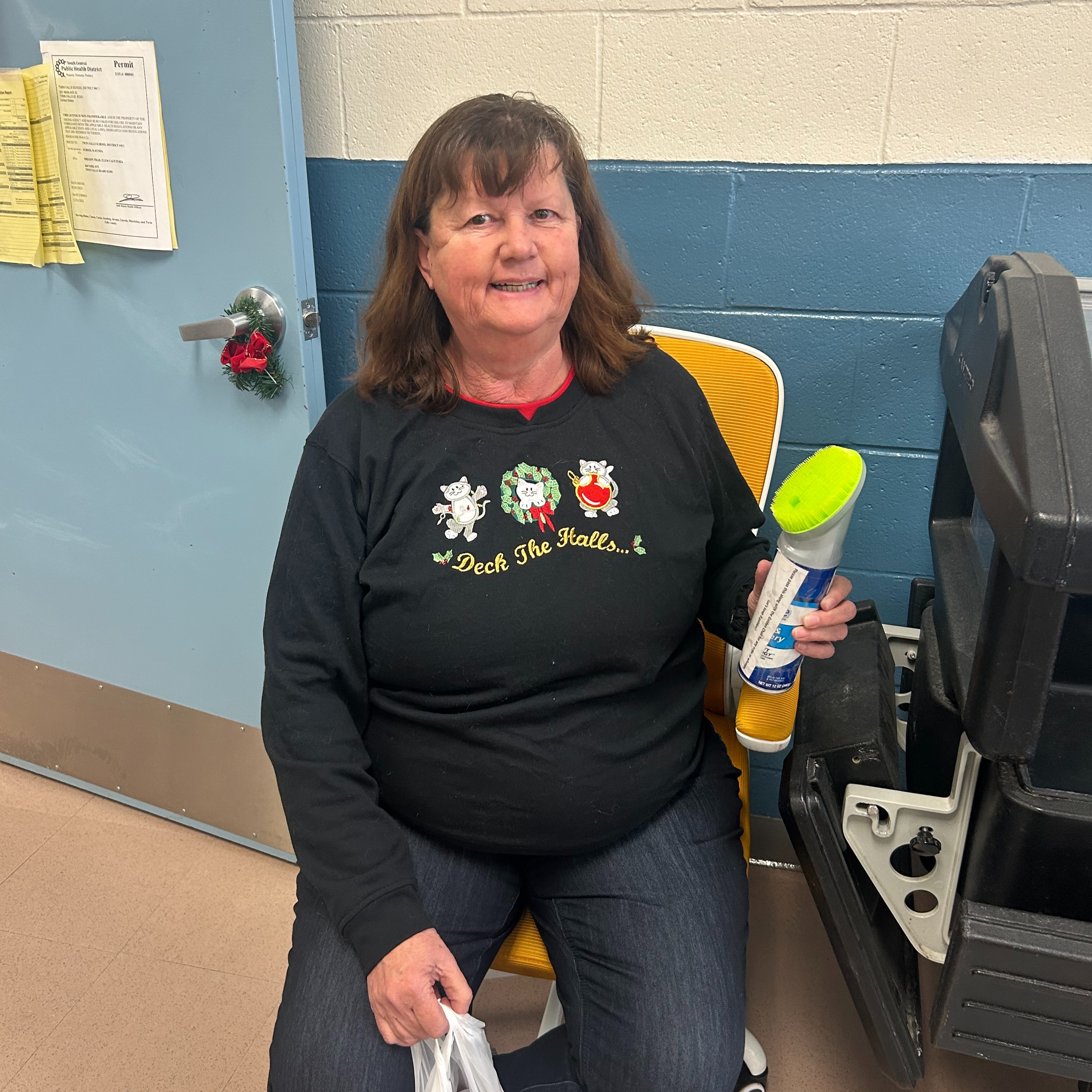 Teacher sitting in golden chair  posing.