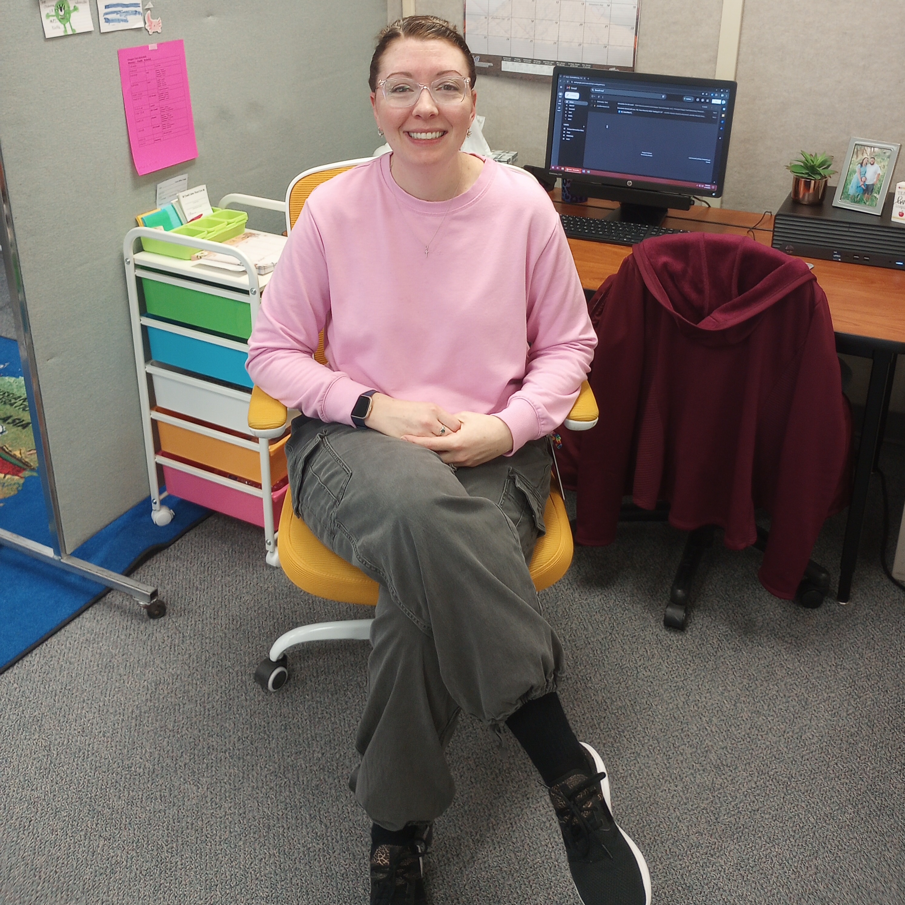 Teacher posing in Golden Chair