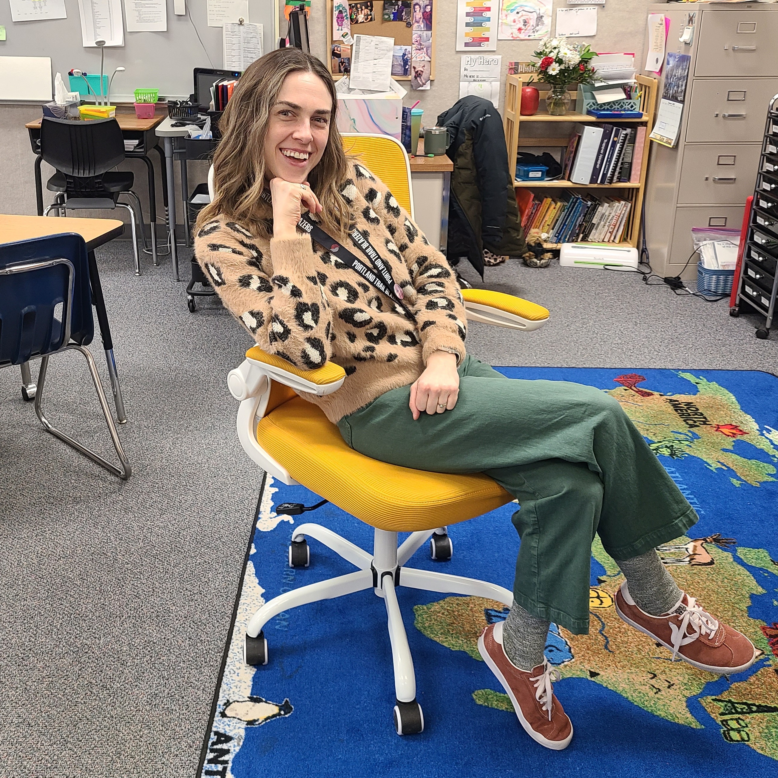 Teacher posing in Golden Chair