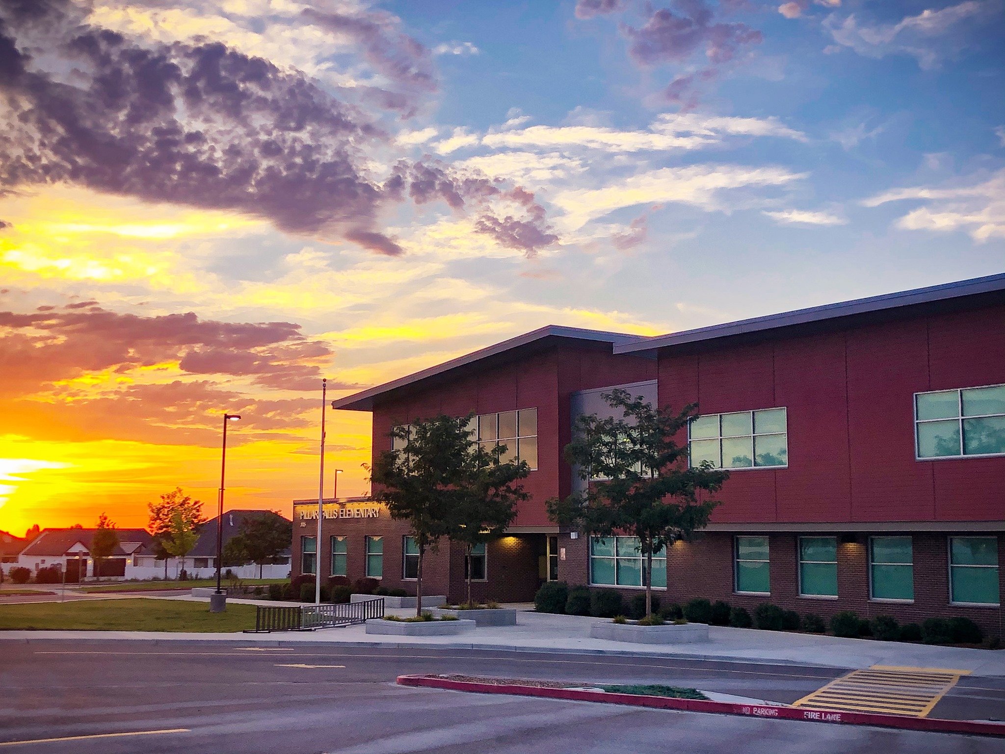 school building with sunset