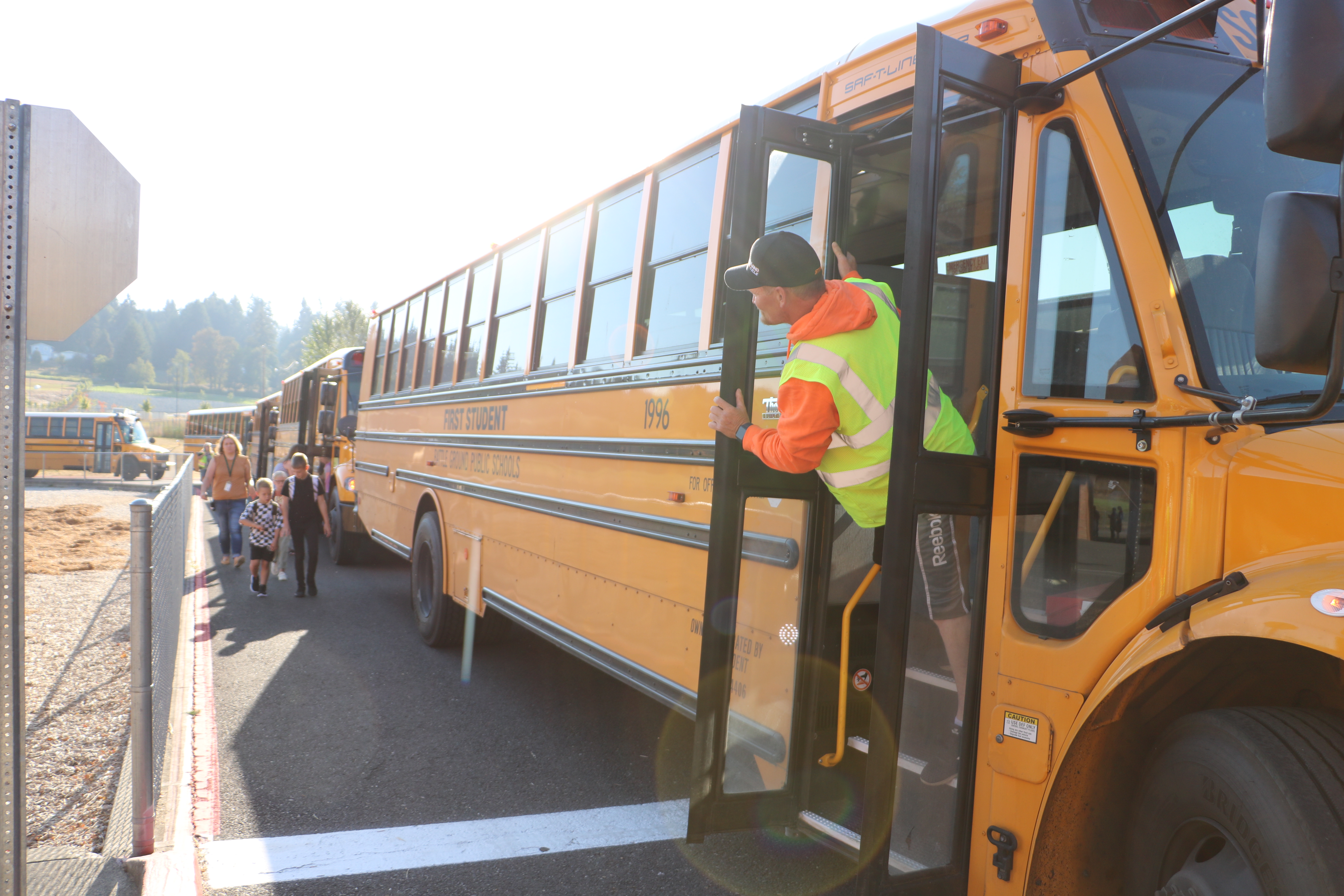 Driver waits for students to board a school bus