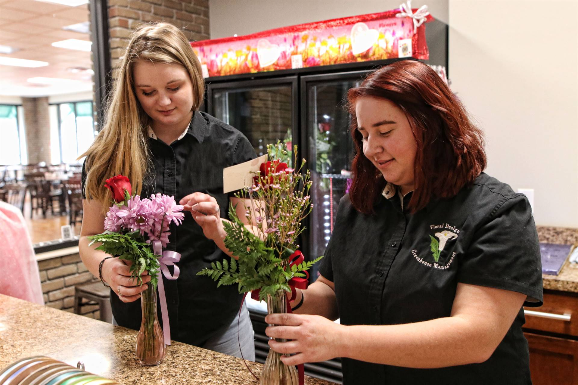 two girls with flowers