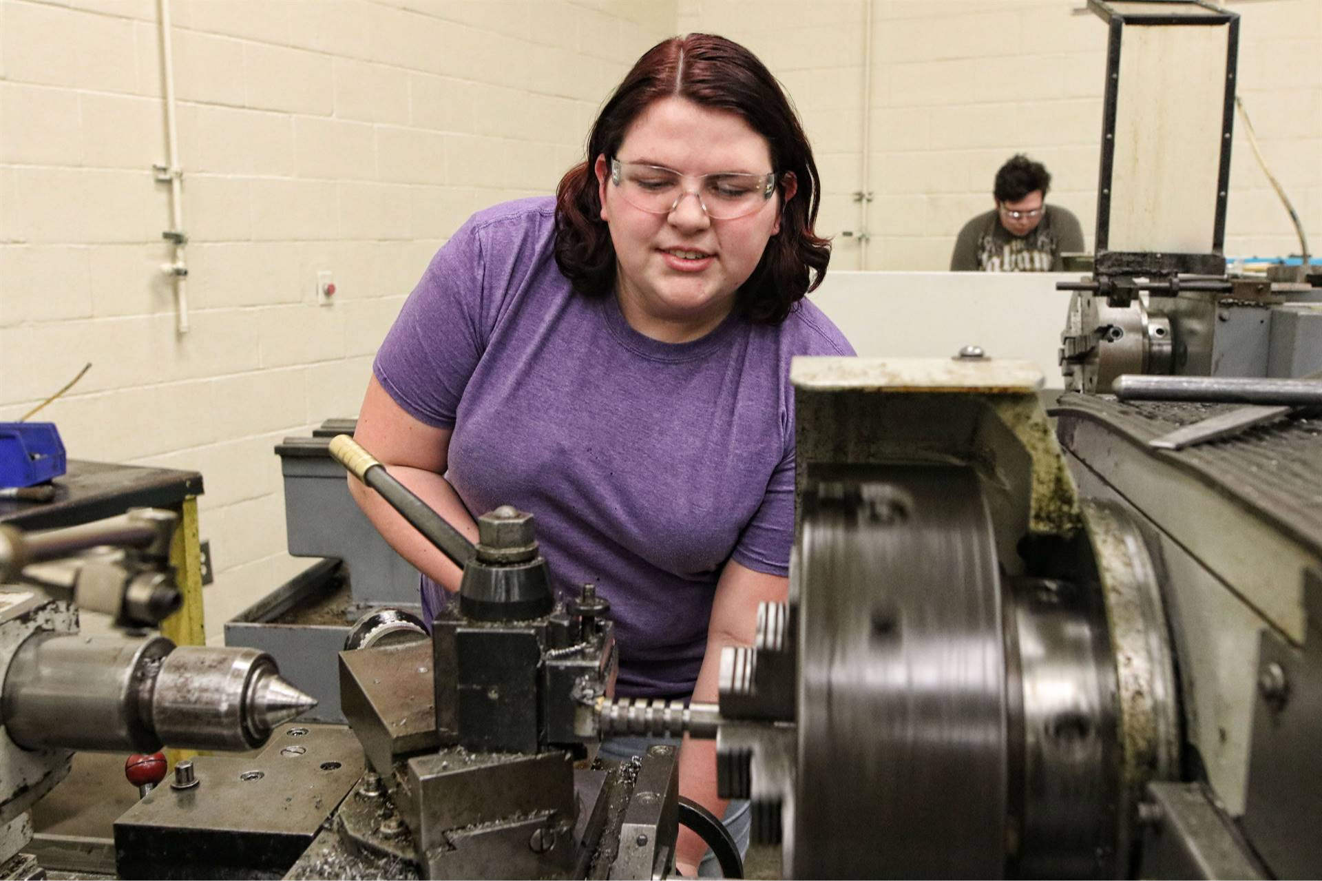 student with a machine