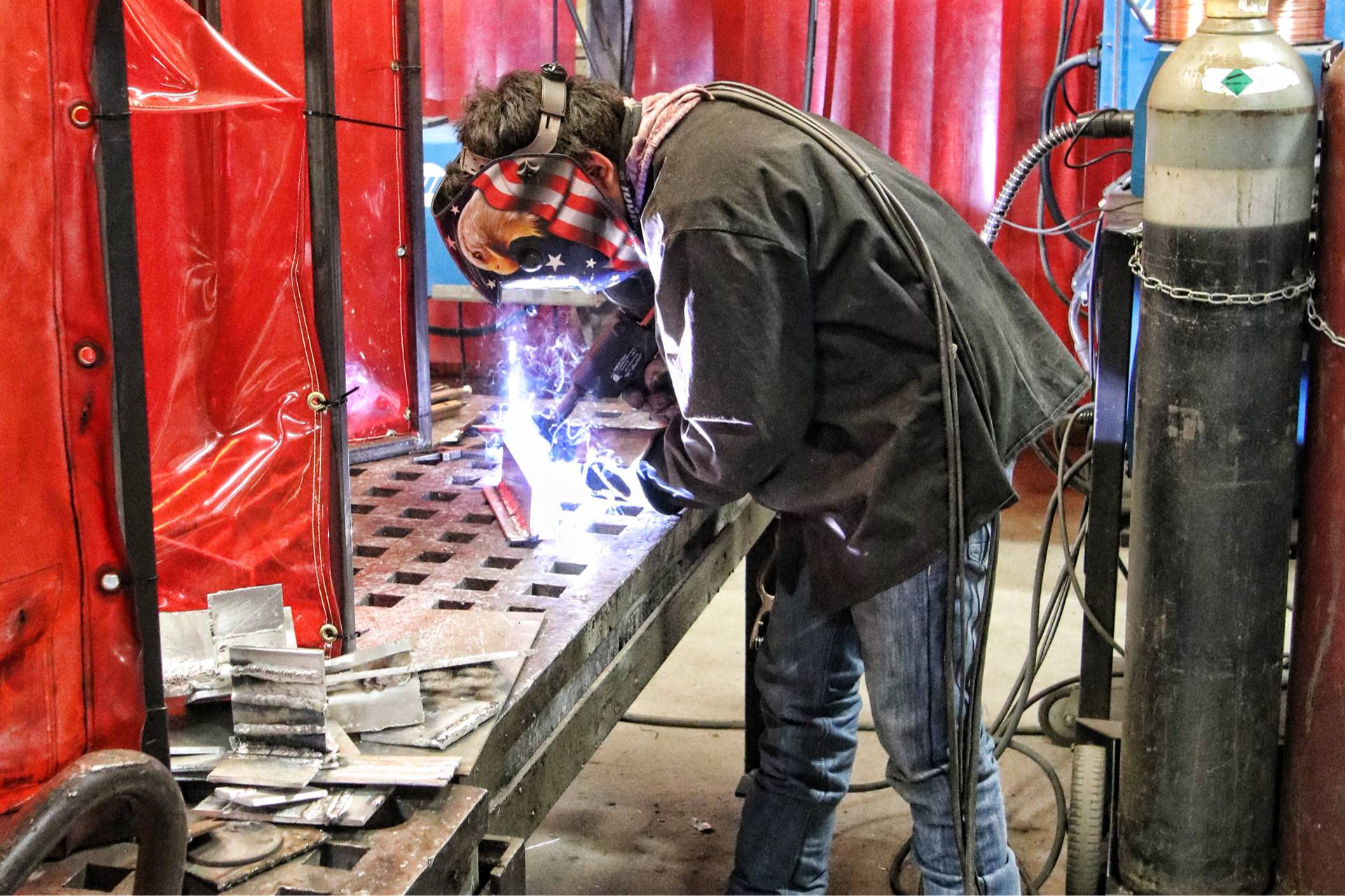 guy wearing a mask welding