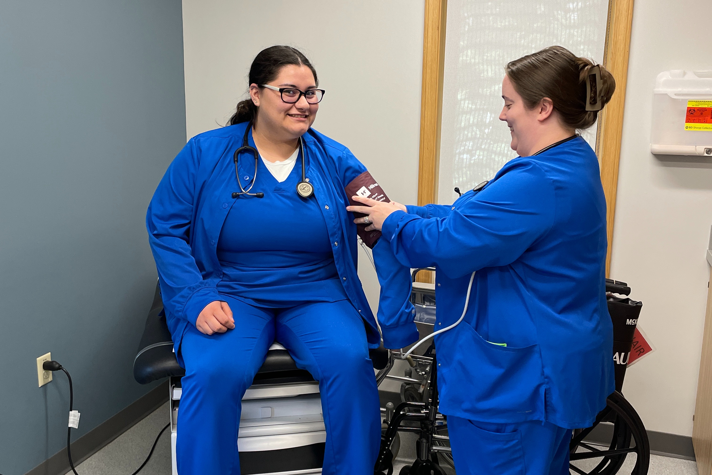 Nurse drawing blood from a patience