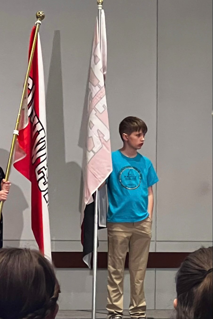 Student holding the School Flag