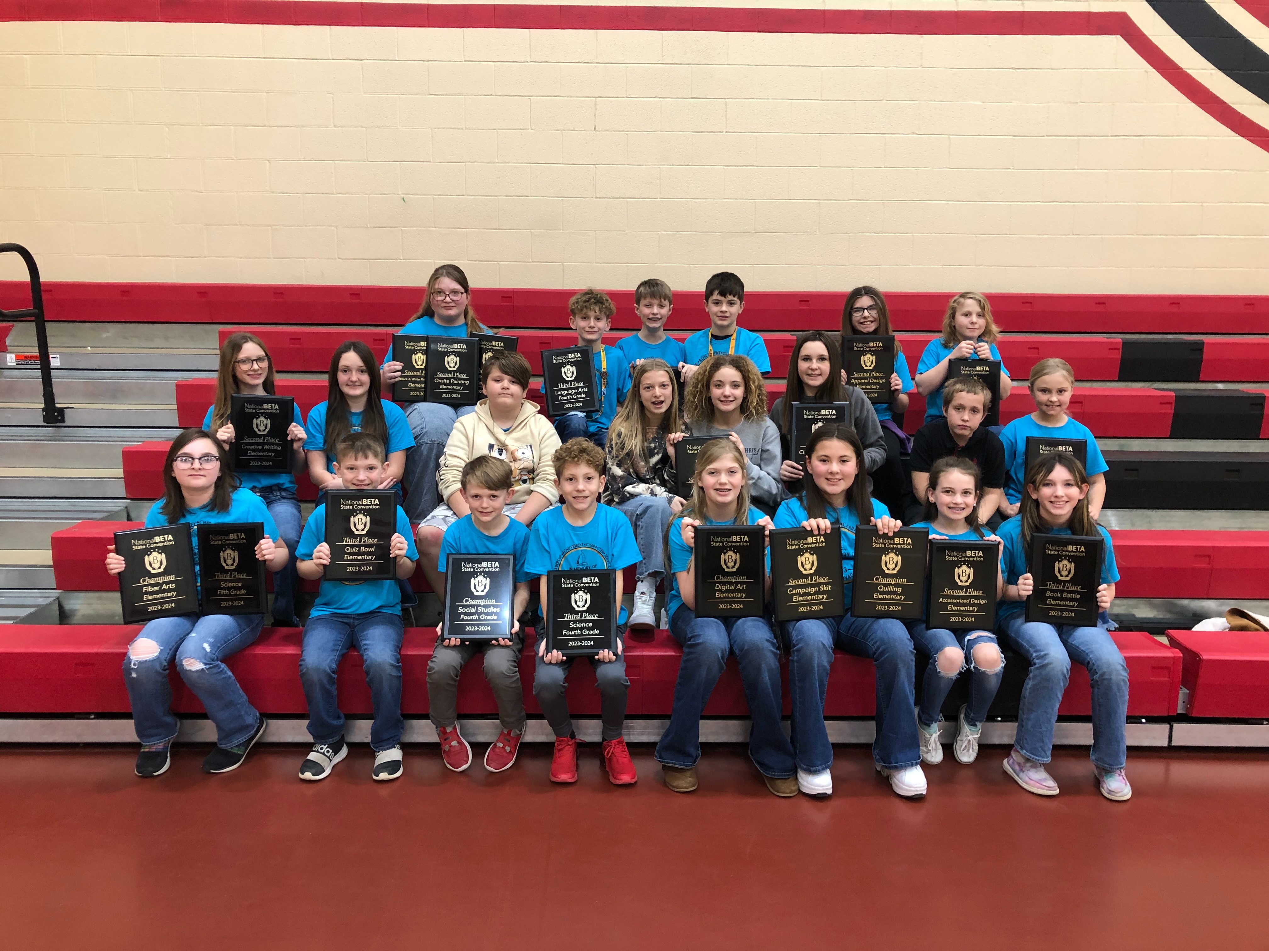 Elementary Students Holding their Beta Club awards