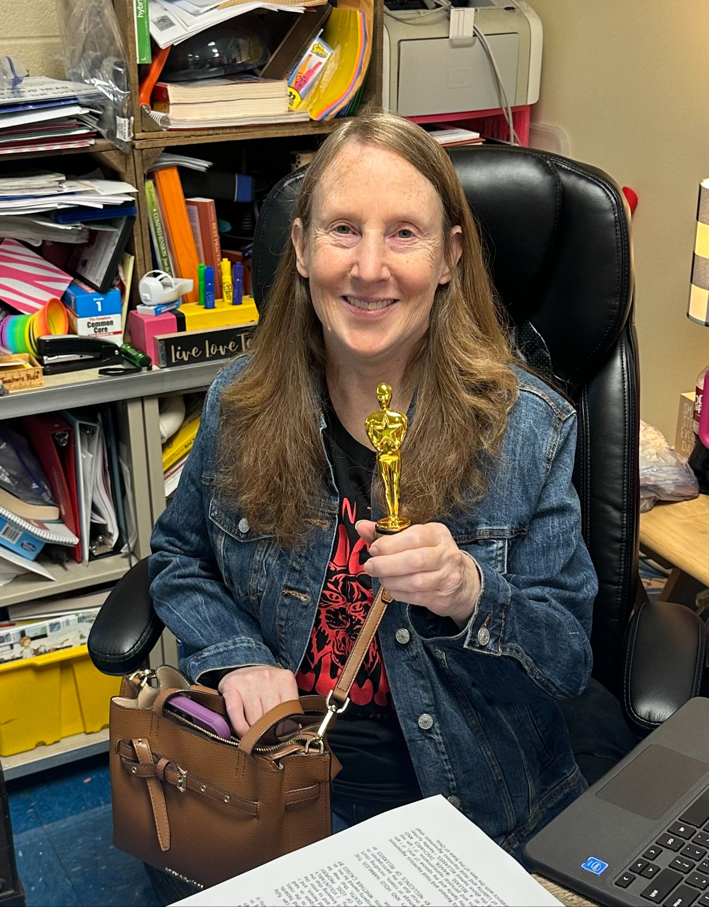 Teacher holding an Award