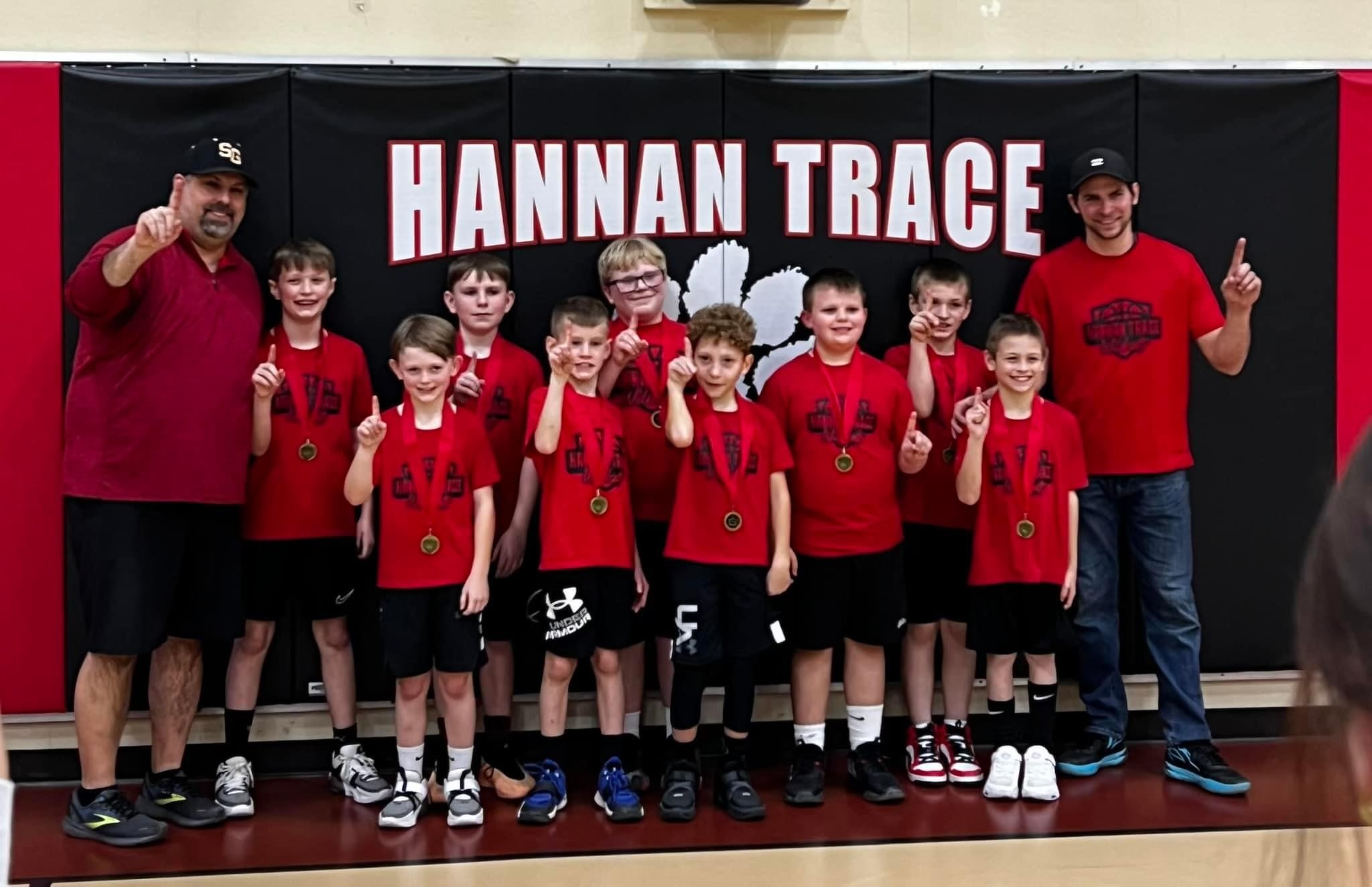 Hannan Trace boys basketball Posing with their Medals