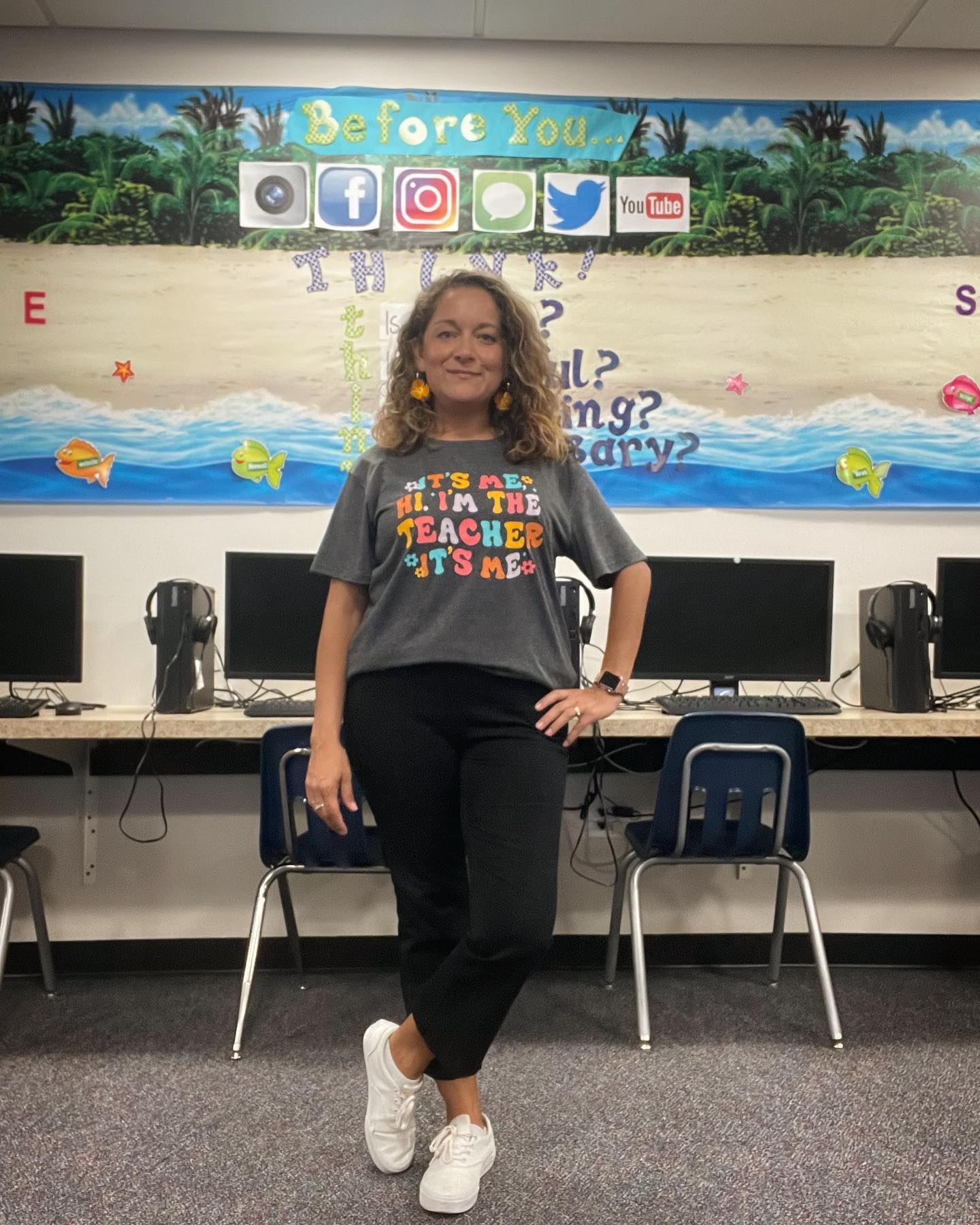 Teacher standing in classroom