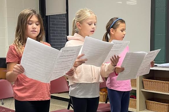 three girls singing