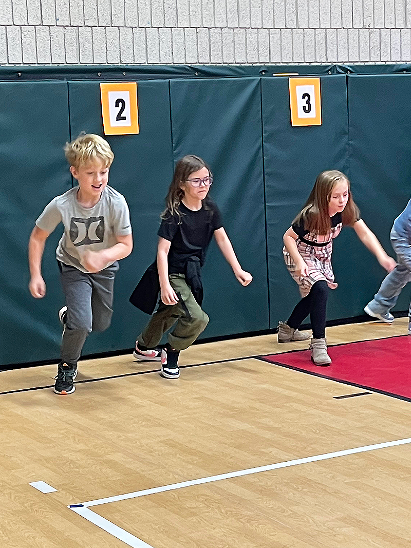 kids running in gym