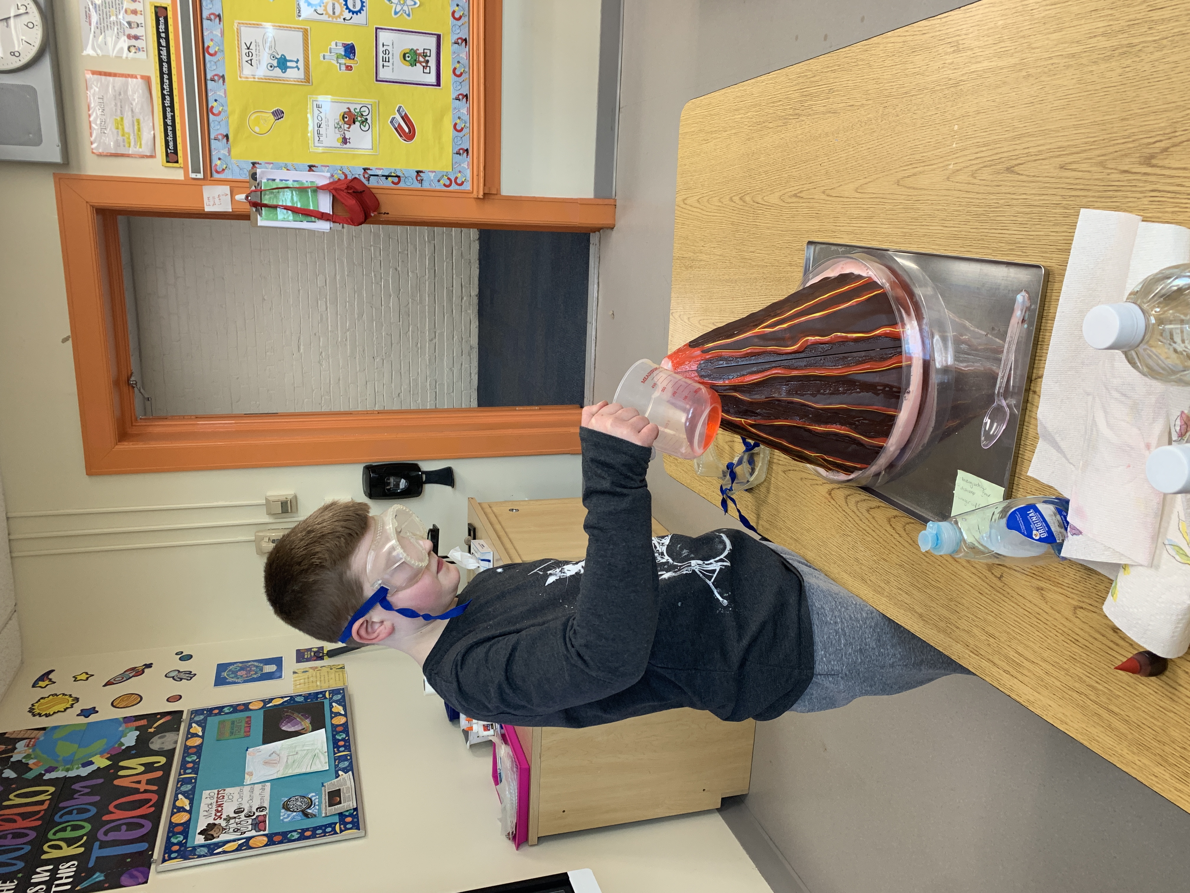 kid doing volcano experiment